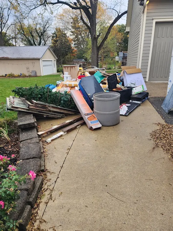 Dumpster being loaded with debris for Residential Dumpster Rental in Streetsboro